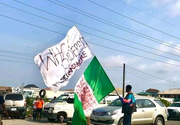 Popular Flag Boy of # EndSARS Protest Returns, he has been spotted in several areas in Lagos state doing his one-man protest